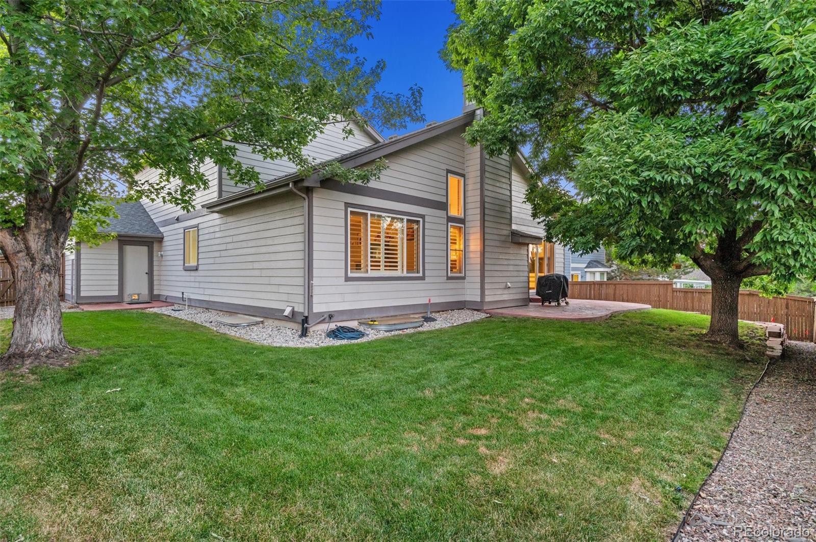 9836 Buckingham Court Highlands Ranch, CO 80130 - Photo 36 of 42 front view of a house with a yard