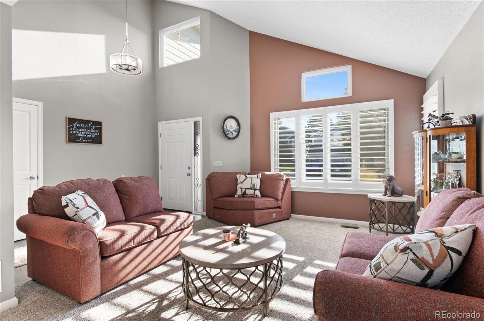 9836 Buckingham Court Highlands Ranch, CO 80130 - Photo 6 of 42 a living room with furniture and a large window