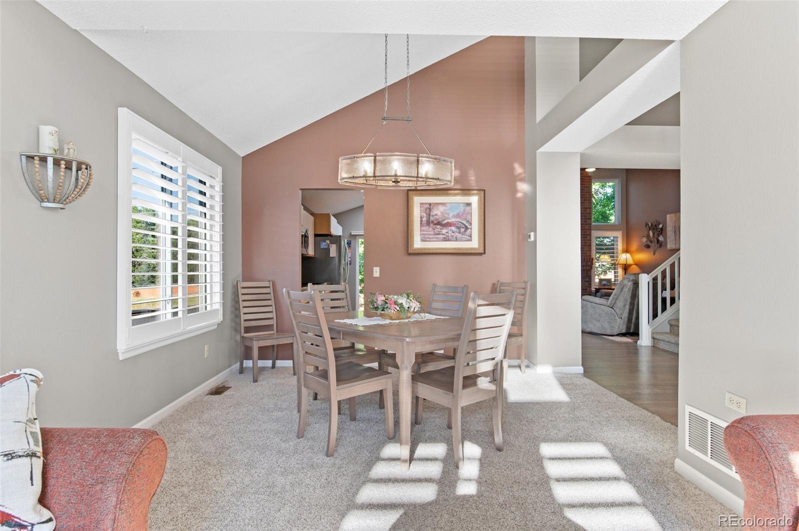 9836 Buckingham Court Highlands Ranch, CO 80130 - Photo 9 of 42 a dining room with furniture and window