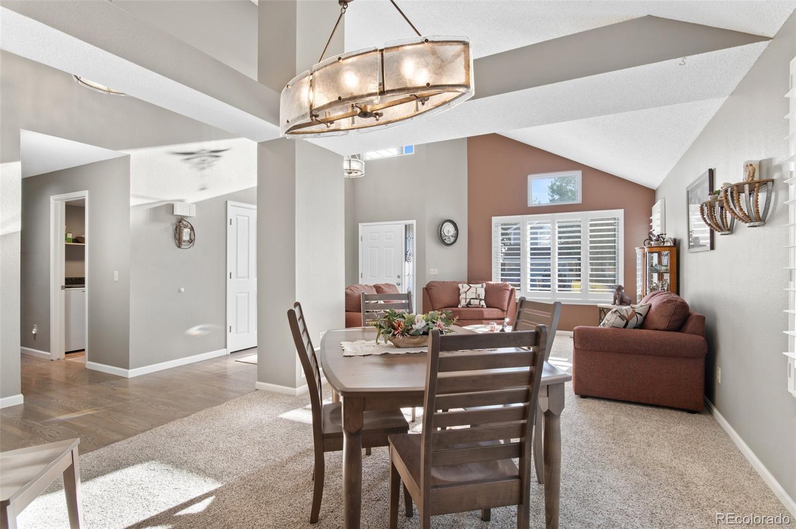 9836 Buckingham Court Highlands Ranch, CO 80130 - Photo 10 of 42 a dining room with furniture and window