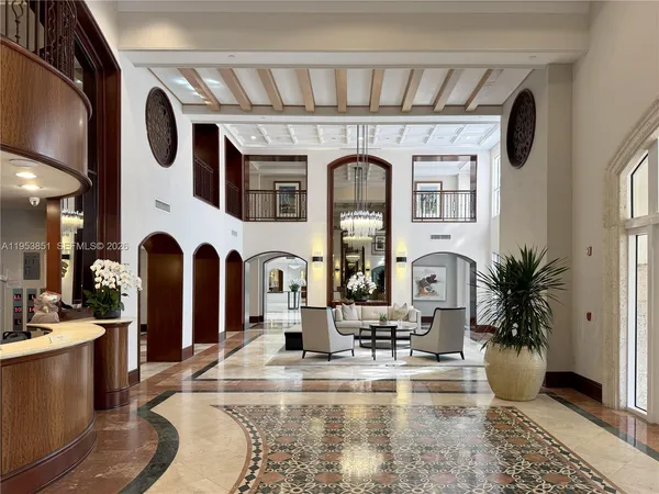 a view of a lobby with furniture and floor to ceiling window