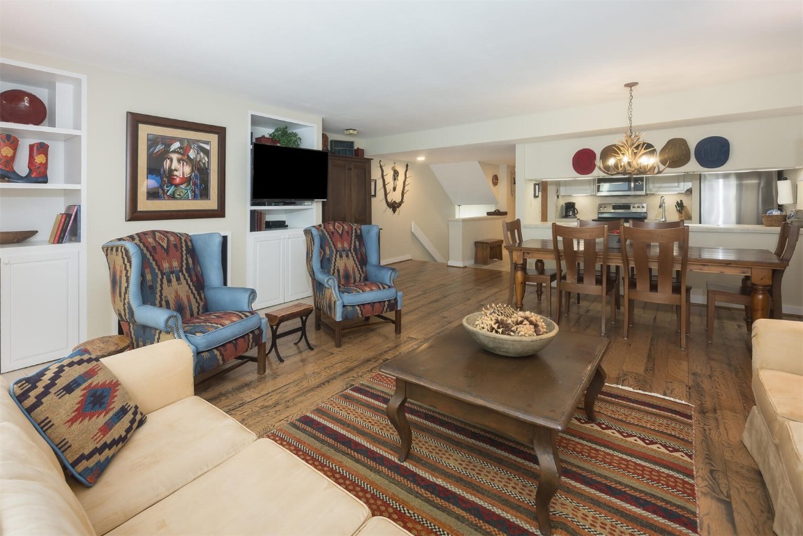 22097 Saints John Road, Unit 2526 Keystone, CO 80435 - Photo 3 of 42 a living room with furniture and a flat screen tv