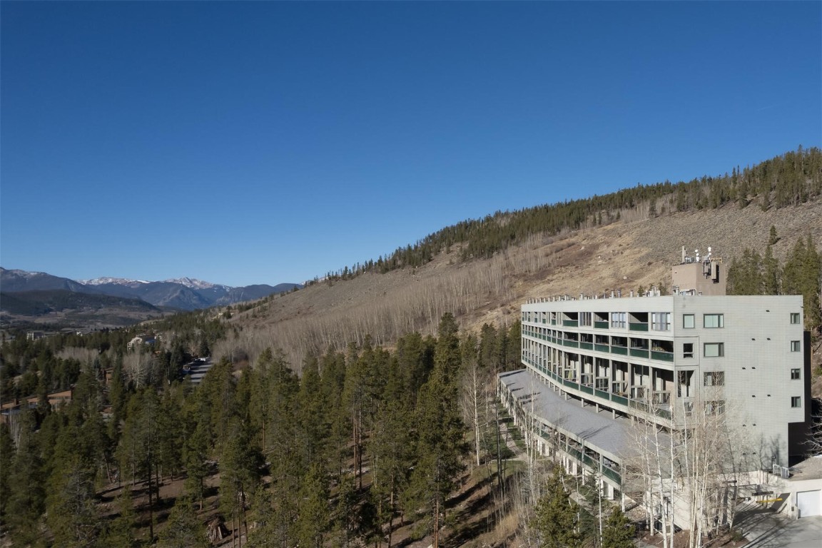 22097 Saints John Road, Unit 2526 Keystone, CO 80435 - Photo 31 of 42 a view of a large building with a mountain in the background