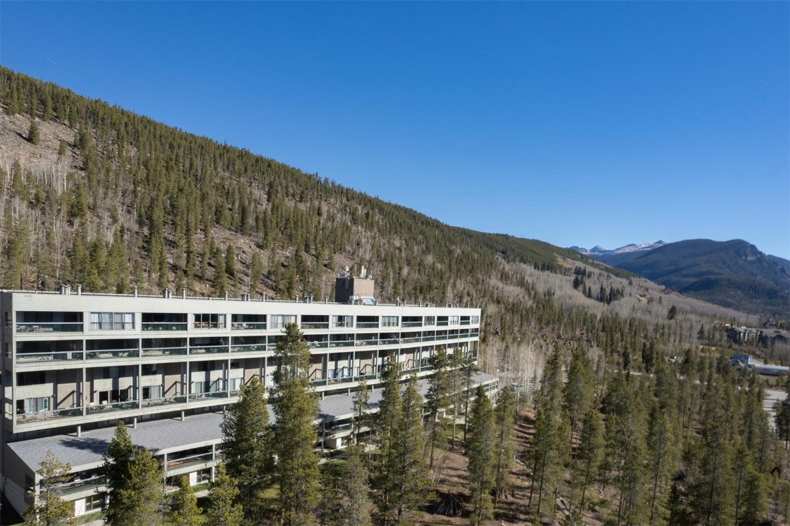 22097 Saints John Road, Unit 2526 Keystone, CO 80435 - Photo 35 of 42 a view of a large building with a mountain in the background