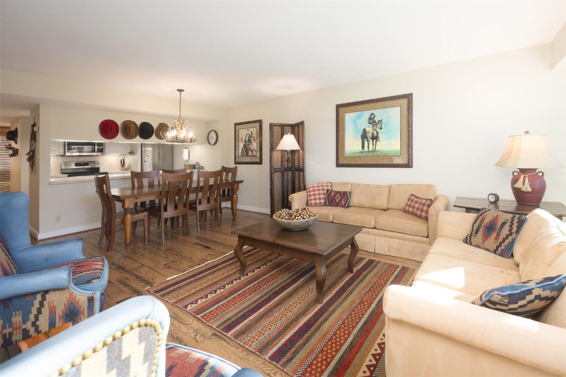 22097 Saints John Road, Unit 2526 Keystone, CO 80435 - Photo 4 of 42 a living room with furniture and view of dining room