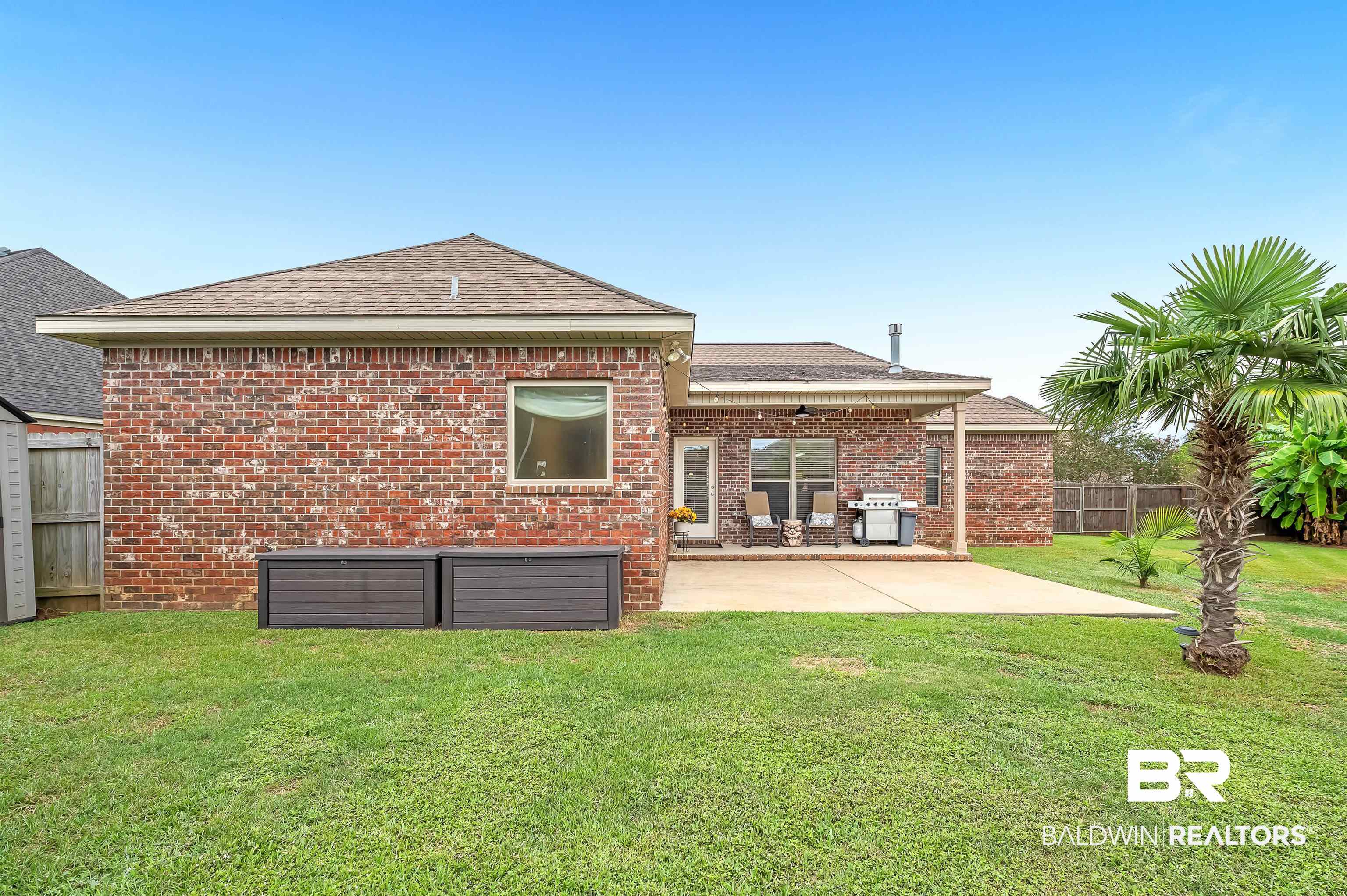 9376 Sable Court Daphne, AL 36526 - Photo 39 of 46 Back of property with a yard and a patio area