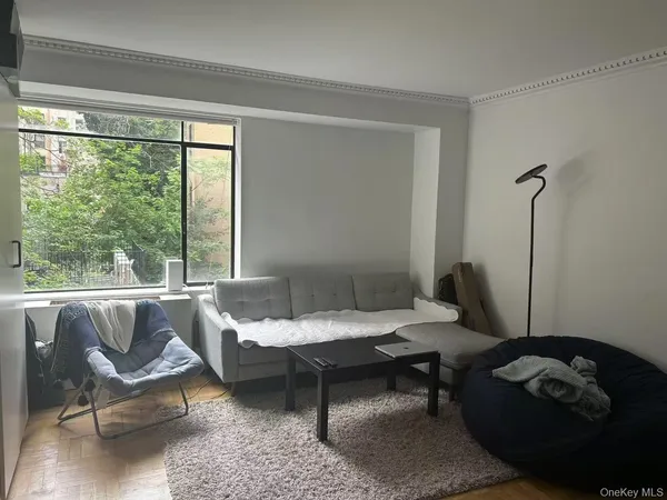 a living room with furniture and a window