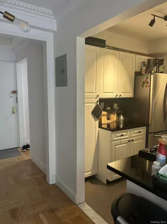 a kitchen with a sink appliances and cabinets