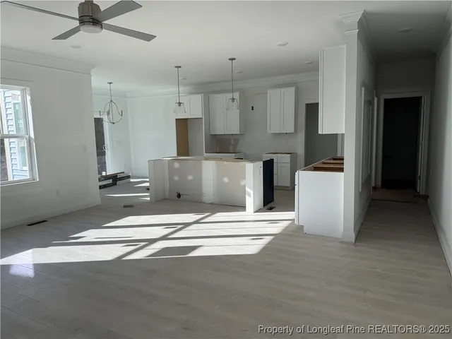 a view of kitchen and refrigerator