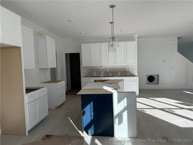 a kitchen with a sink stove and refrigerator