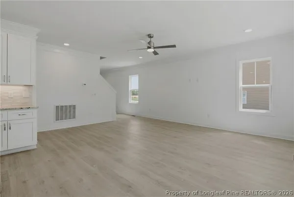 a bathroom with a granite countertop sink vanity and mirror