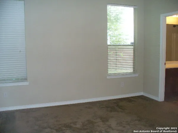 a bathroom with a shower and a toilet