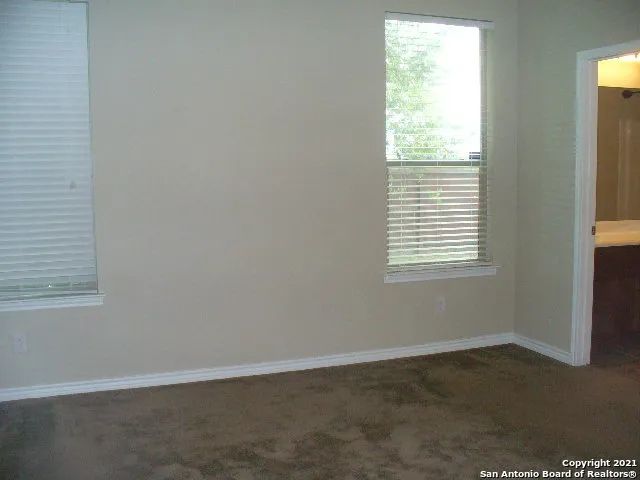 a bathroom with a shower and a toilet