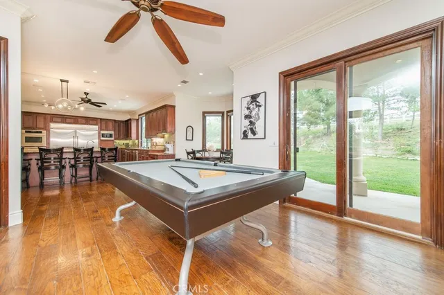 a bedroom with a bed and dresser with mirror