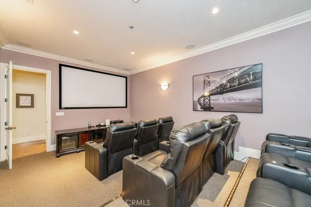 a view of a pathway both side of flower garden with wooden fence