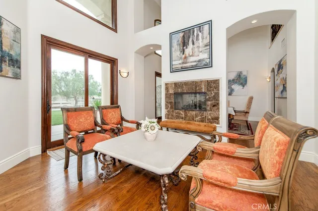 a living room with furniture wooden floor and a table