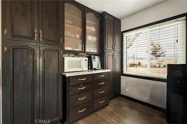 a bedroom with a bed and a ceiling fan