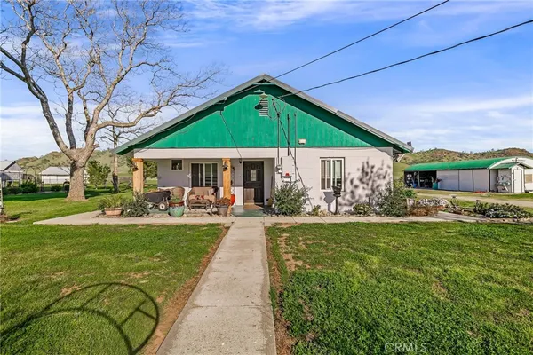 a view of a big house with a big yard