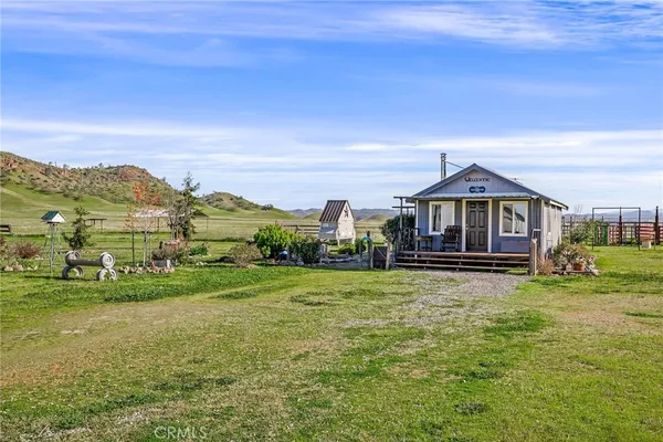 a view of a lake with houses in the back