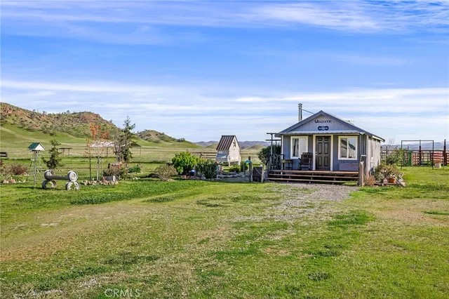 a view of a lake with houses in the back