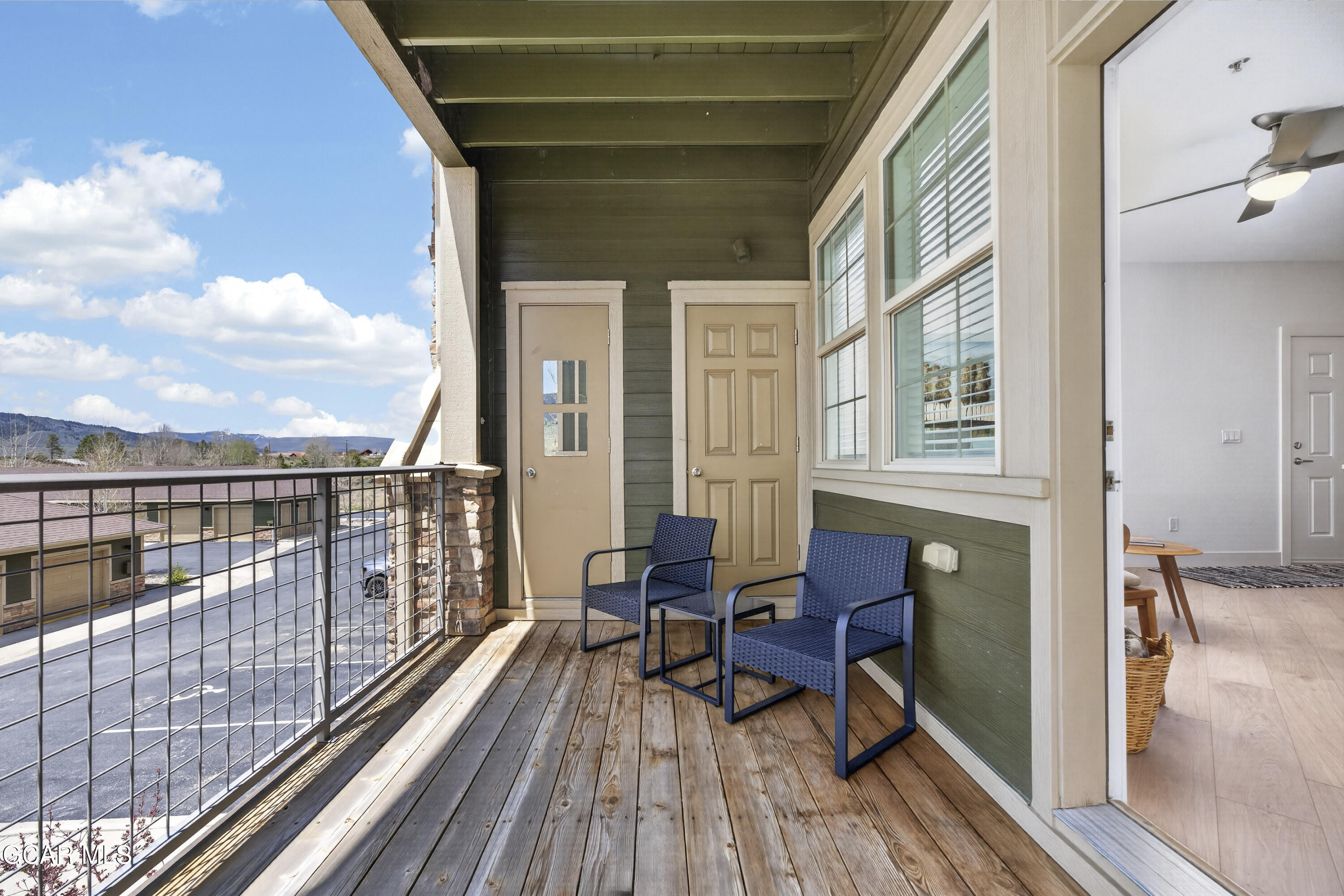 160 Village Road, Unit F207 Granby, CO 80446 - Photo 10 of 28 a balcony with table and chairs