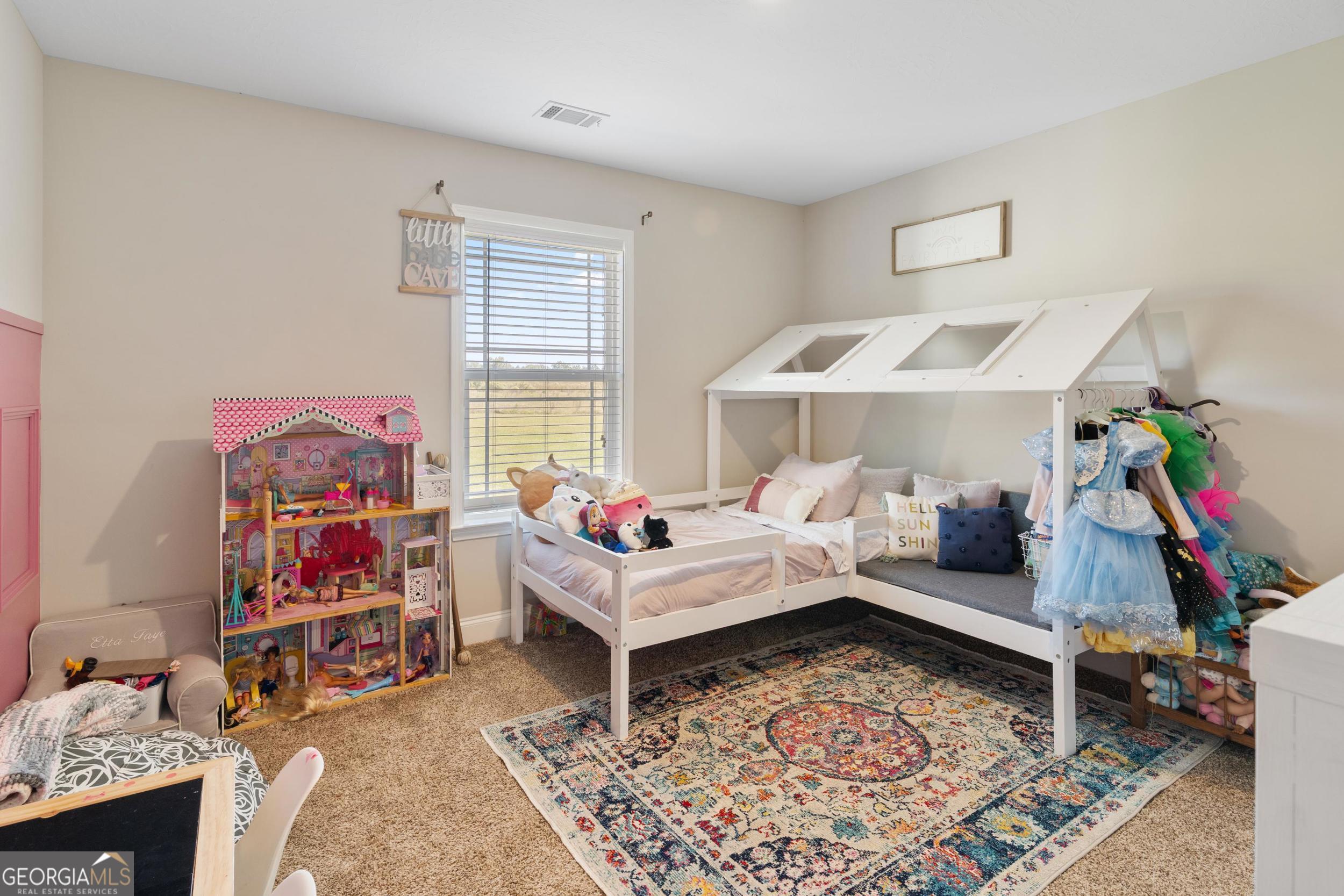 1287 Idlewood-Munnerlyn Road Waynesboro, GA 30830 - Photo 28 of 48 a living room with furniture and a rug