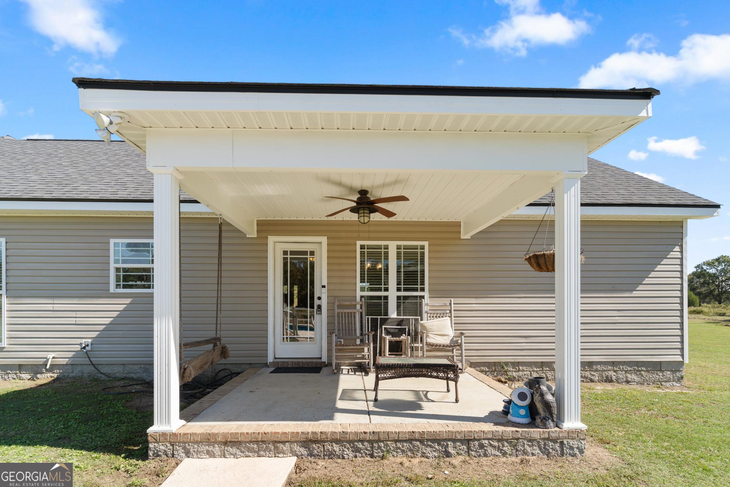 1287 Idlewood-Munnerlyn Road Waynesboro, GA 30830 - Photo 32 of 48 a view of a house with a patio