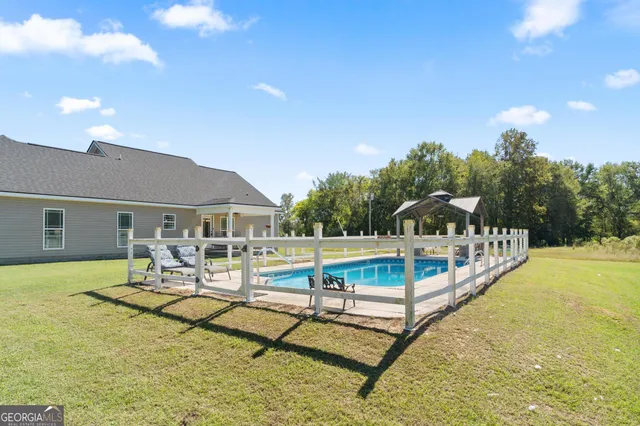 a view of a patio with swimming pool