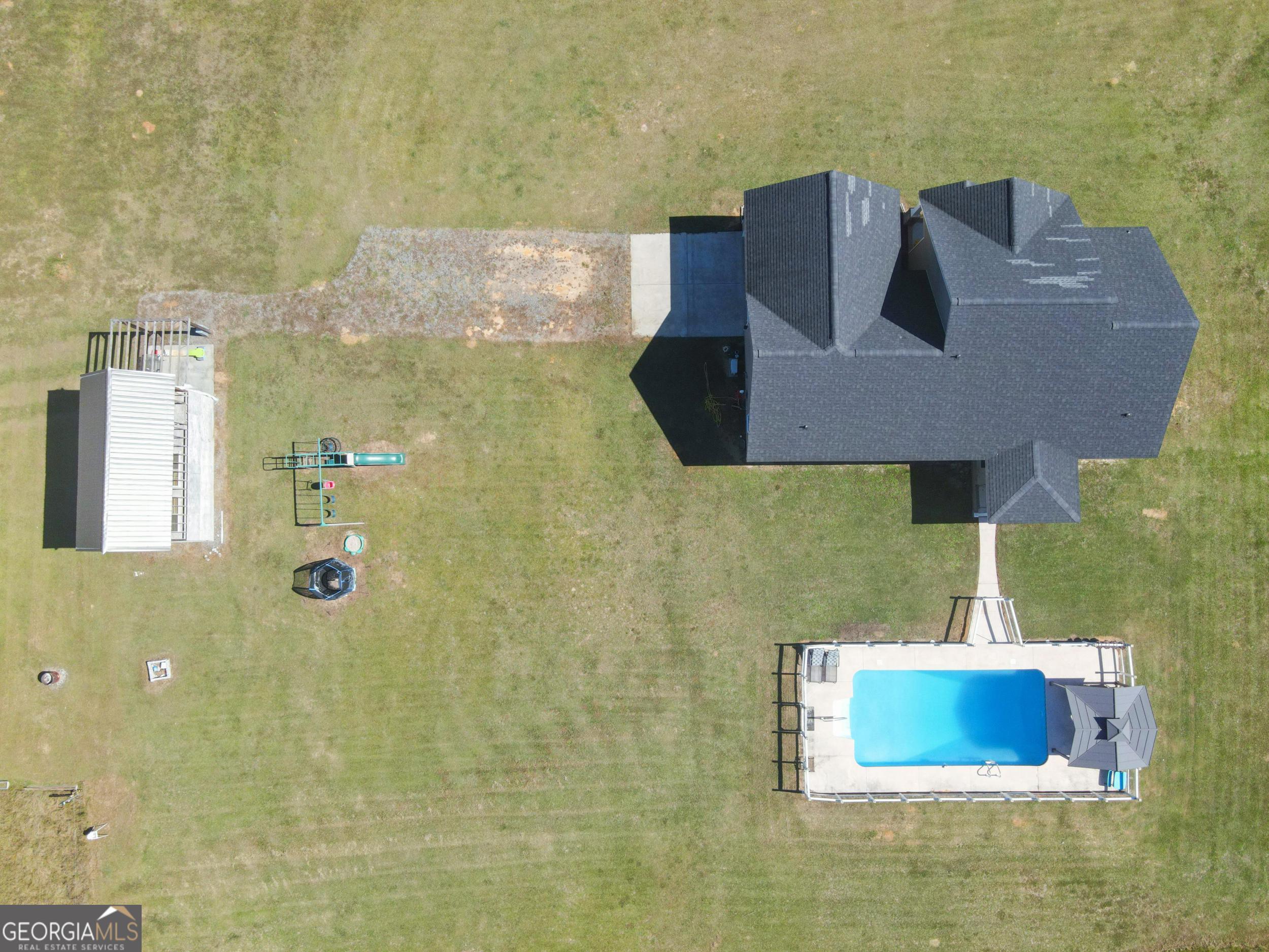 1287 Idlewood-Munnerlyn Road Waynesboro, GA 30830 - Photo 35 of 48 a bathroom with a sink mirror and vanity