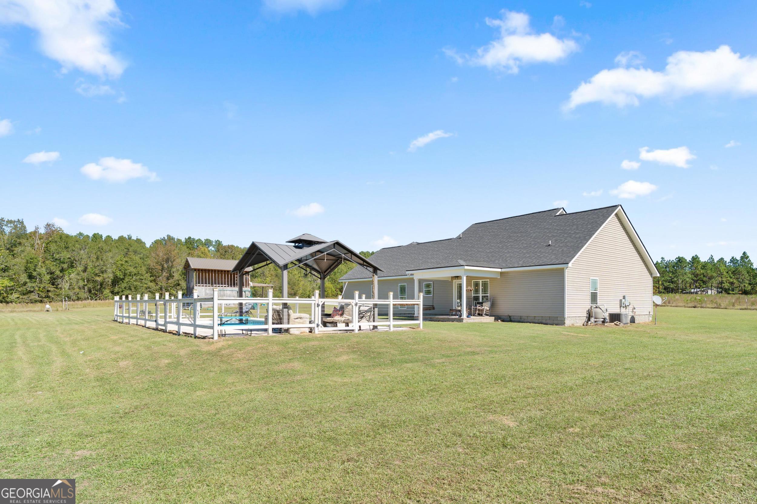 1287 Idlewood-Munnerlyn Road Waynesboro, GA 30830 - Photo 45 of 48 a view of a house with a yard