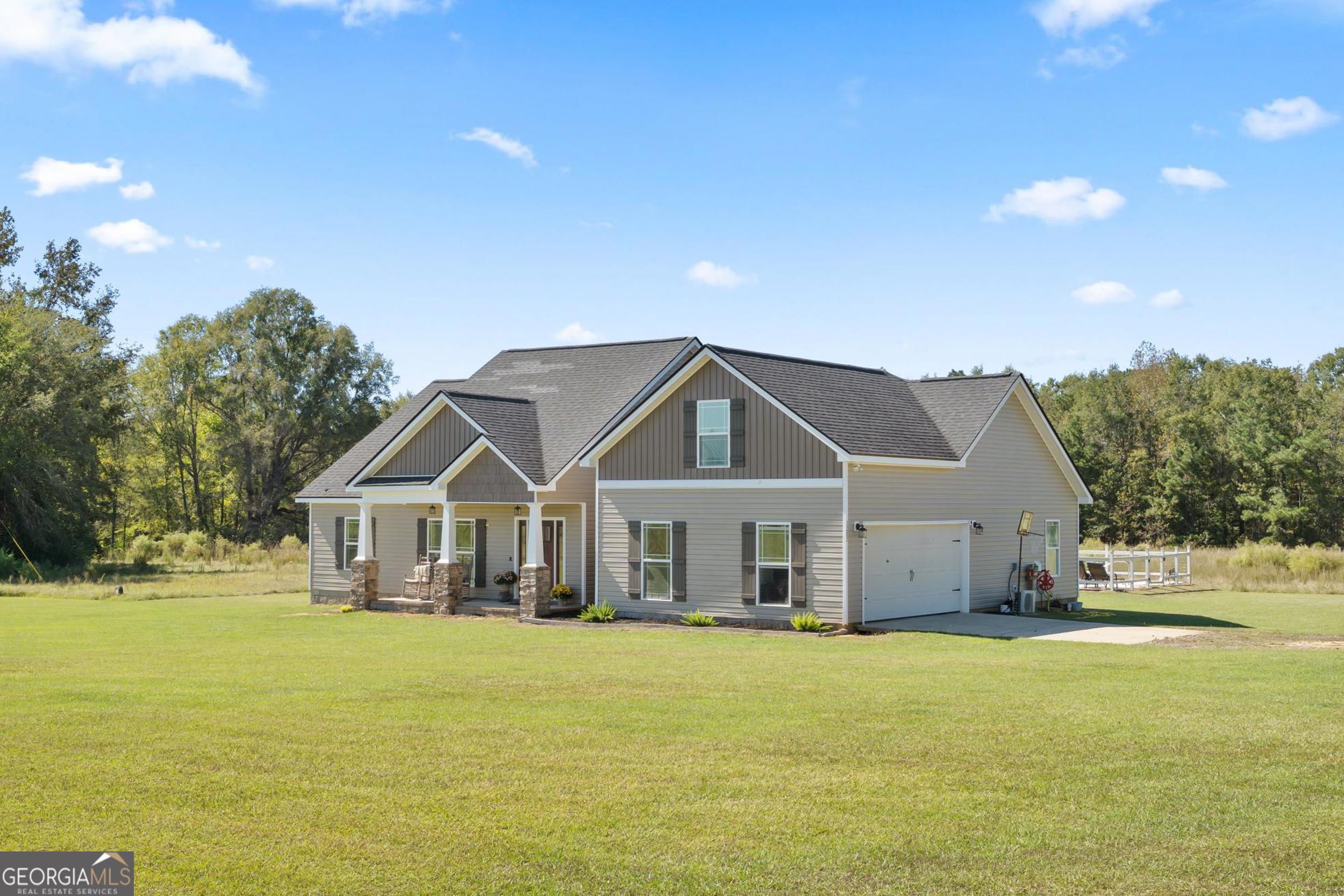 1287 Idlewood-Munnerlyn Road Waynesboro, GA 30830 - Photo 47 of 48 a house view with a garden space