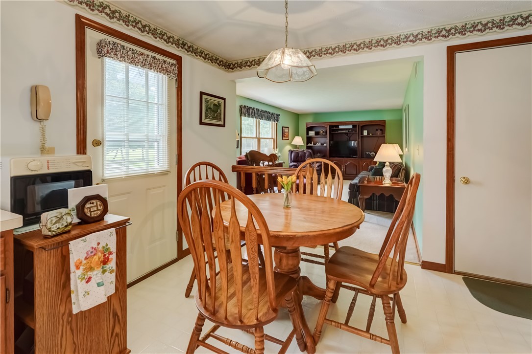 39 Highview Circle Sweden, NY 14420 - Photo 18 of 43 eat-in area of the kitchen with door to the deck.