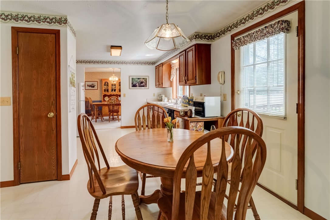 39 Highview Circle Sweden, NY 14420 - Photo 19 of 43 kitchen eat-in area with pantry closet door on the