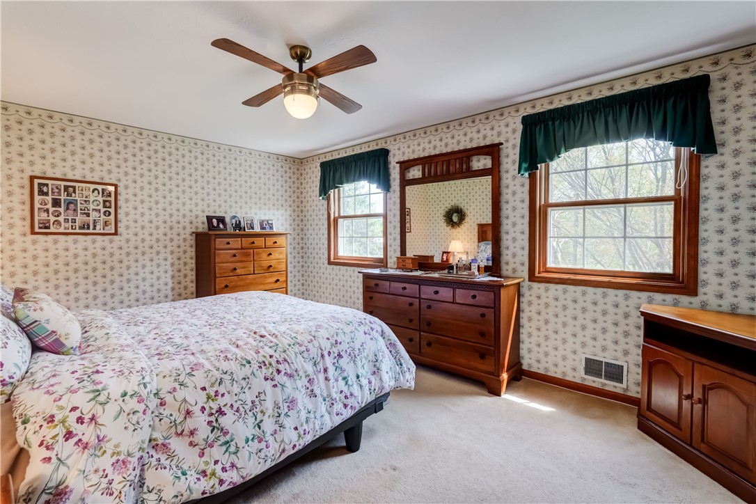39 Highview Circle Sweden, NY 14420 - Photo 27 of 43 primary bedroom with ceiling fan/light