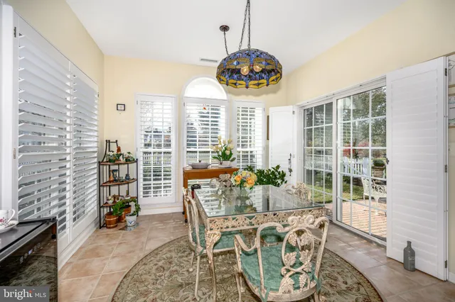 a kitchen with stainless steel appliances granite countertop a stove a sink dishwasher and cabinets with wooden floor