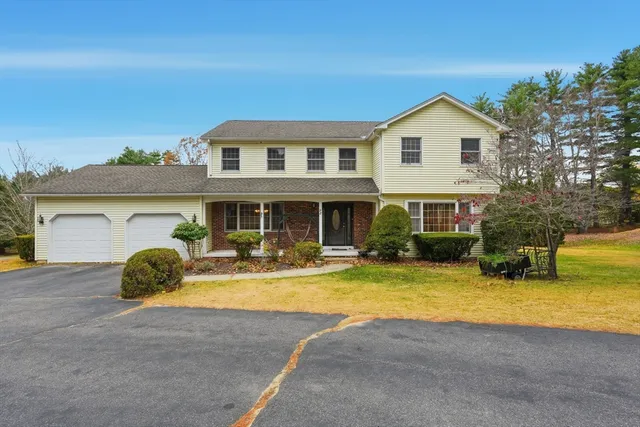 a view of a house with swimming pool and sitting area