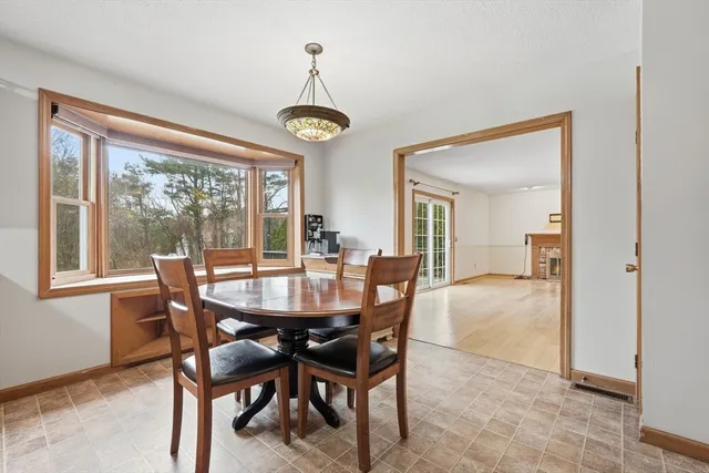 a view of a dining room with furniture window and outside view