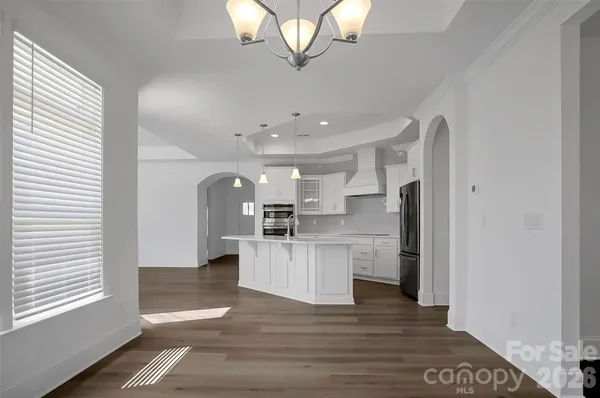 a kitchen with stainless steel appliances a refrigerator and a sink