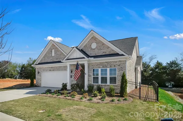 a front view of a house with yard
