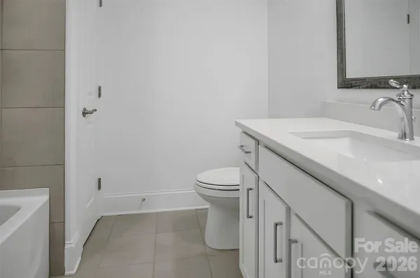a bathroom with a sink toilet and vanity