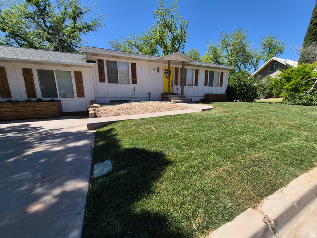 175 North 160 East Hurricane, UT 84737 - Photo 2 of 43 Single story home with board and batten siding and a front lawn