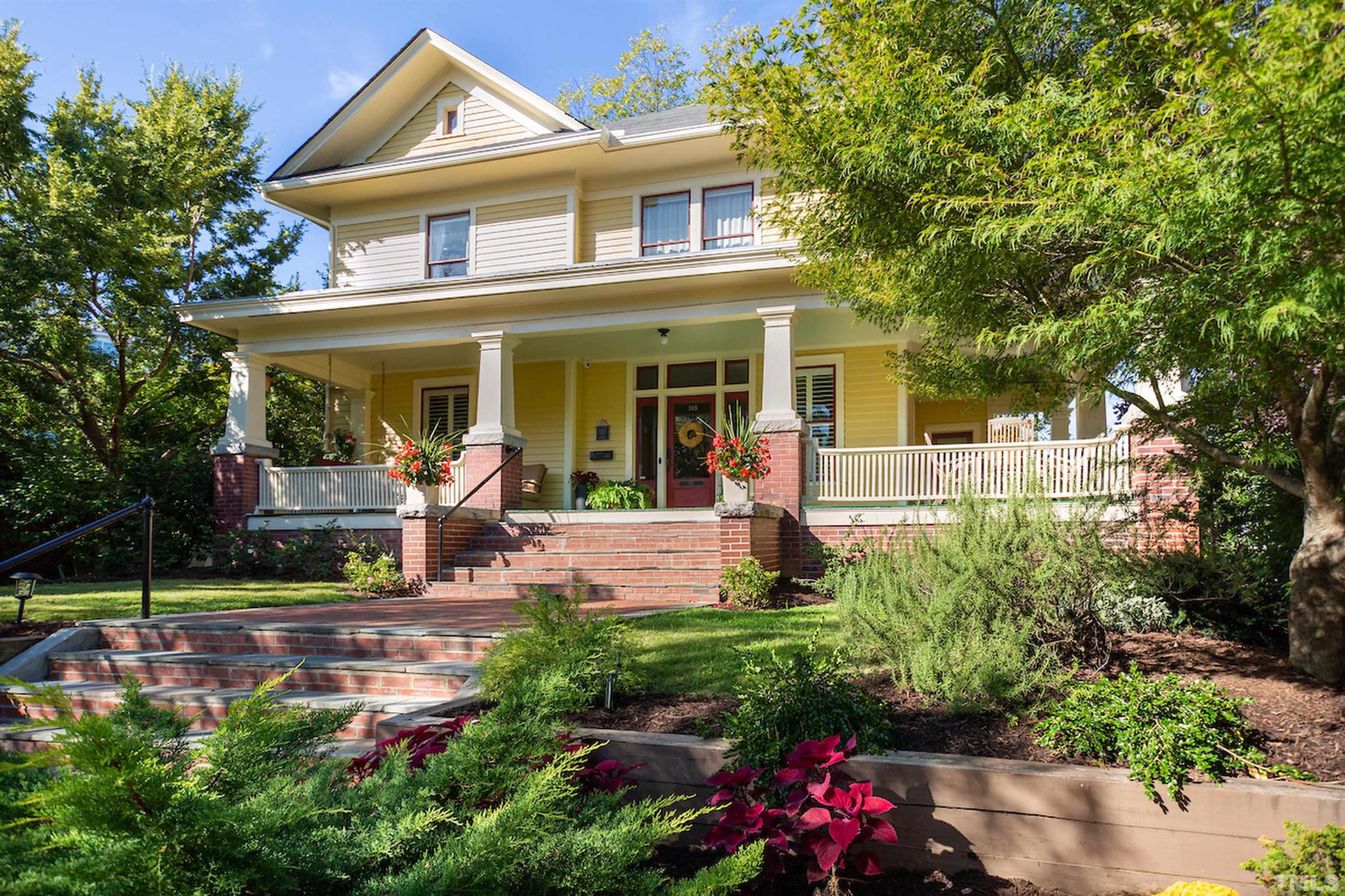 115 Watts Street Durham, NC 27701 - Photo 2 of 30 a front view of a house with garden