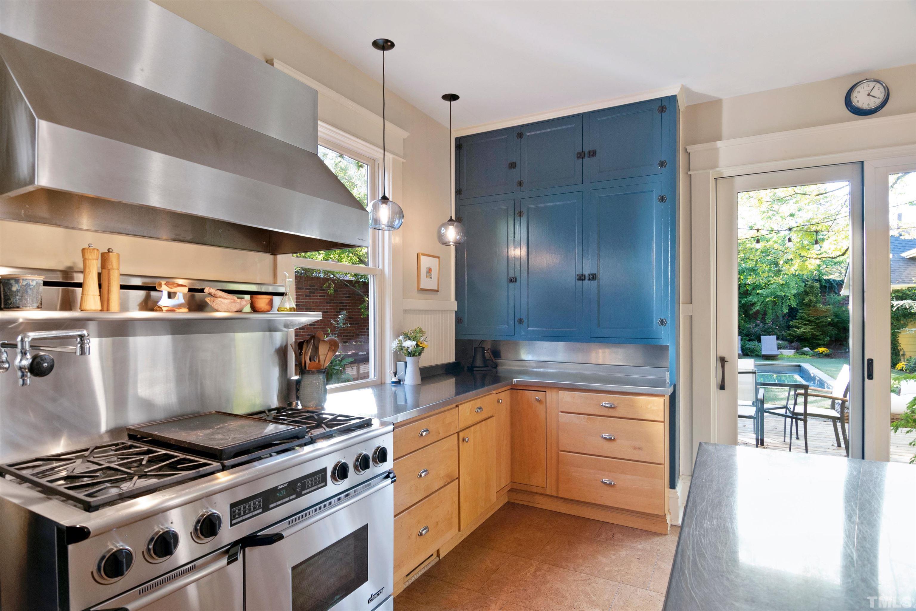115 Watts Street Durham, NC 27701 - Photo 11 of 30 a kitchen with stove and cabinets