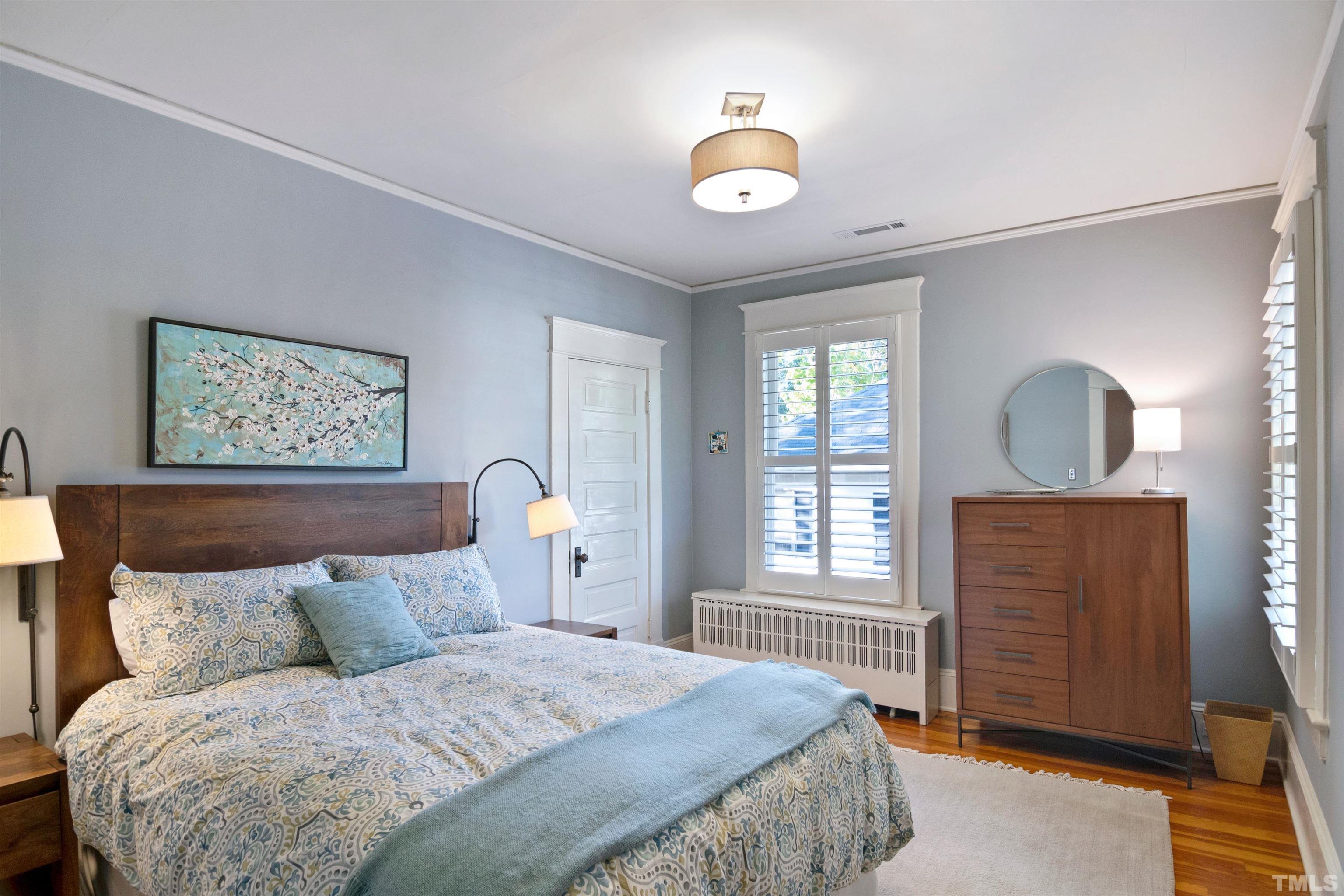 115 Watts Street Durham, NC 27701 - Photo 20 of 30 a bedroom with a large bed and a window