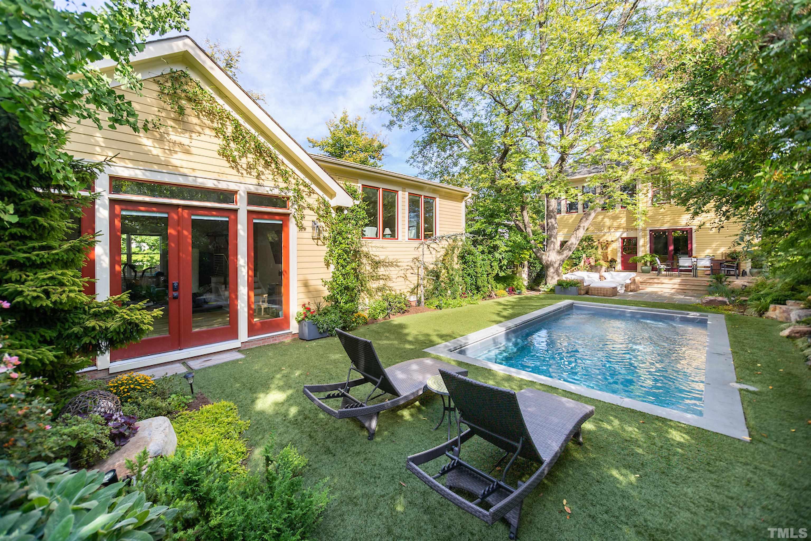 115 Watts Street Durham, NC 27701 - Photo 22 of 30 front view of a house with a yard table and chairs
