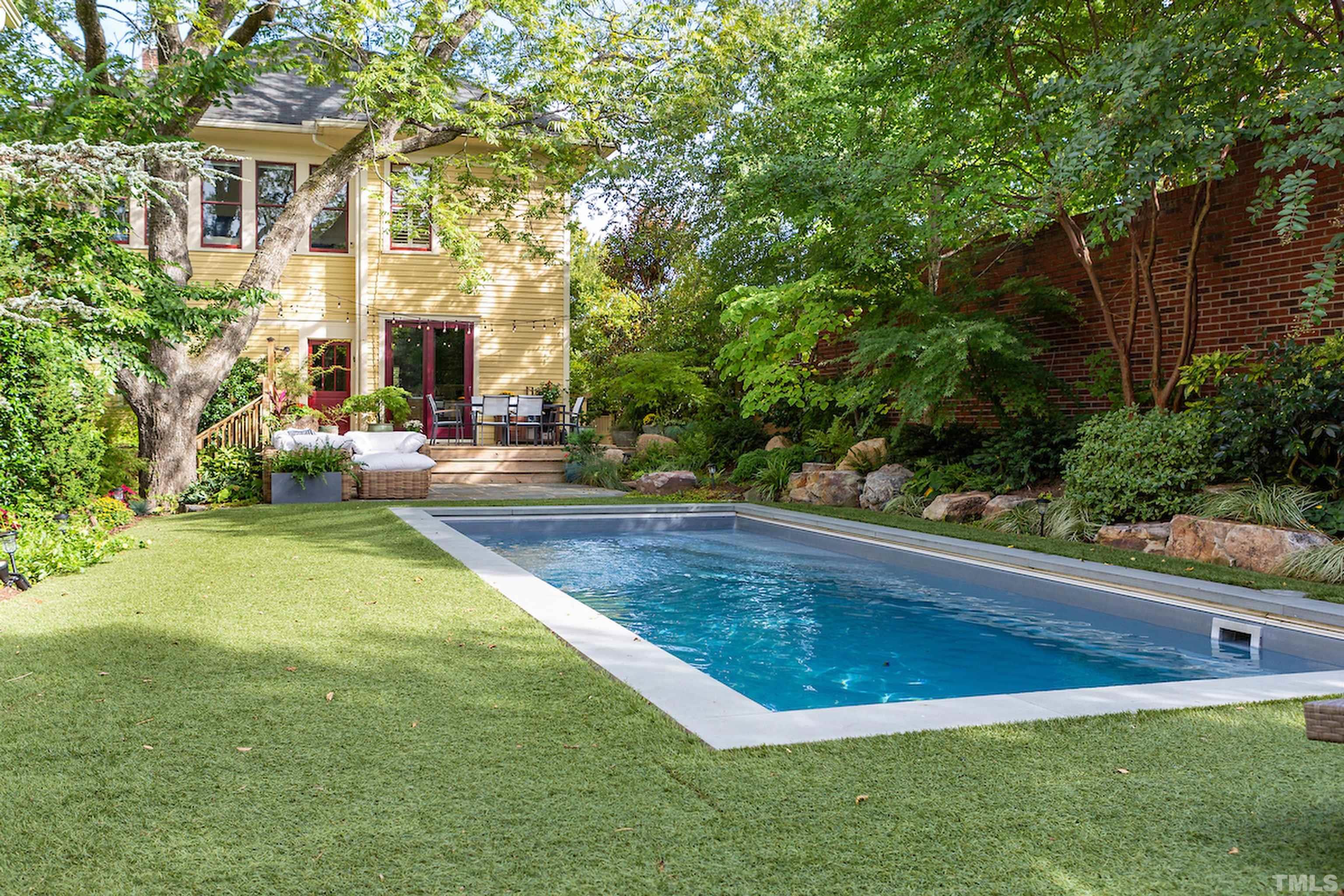 115 Watts Street Durham, NC 27701 - Photo 23 of 30 a view of outdoor space yard and swimming pool