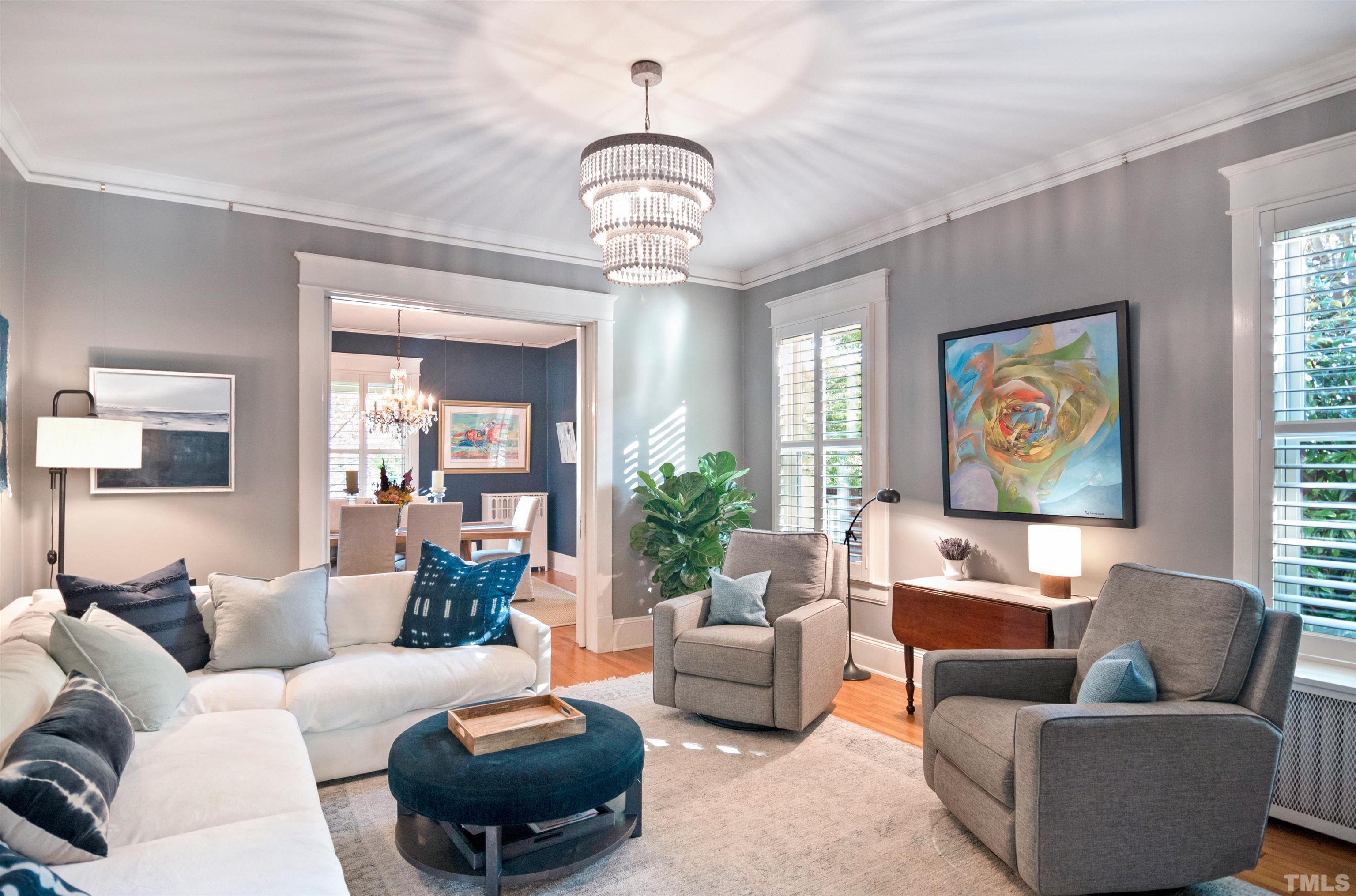 115 Watts Street Durham, NC 27701 - Photo 8 of 30 a living room with furniture and a chandelier