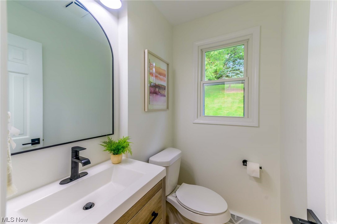 1820 Spring Valley Avenue Northwest Canton, OH 44708 - Photo 11 of 32 Bathroom featuring toilet and vanity