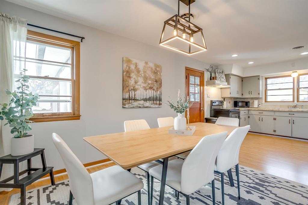 809 Euclid Street Cleburne, TX 76033 - Photo 11 of 26 a view of a dining room with furniture window and wooden floor