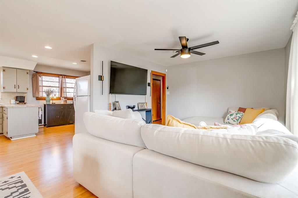 809 Euclid Street Cleburne, TX 76033 - Photo 12 of 26 a living room with furniture and a flat screen tv